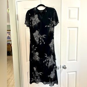 Layered black dress w/ sheer panel. Grey/white floral print. Size 16W $20